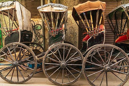 India, West Bengal, Kolkata, College Square. Rickshaws in a line. Art Print